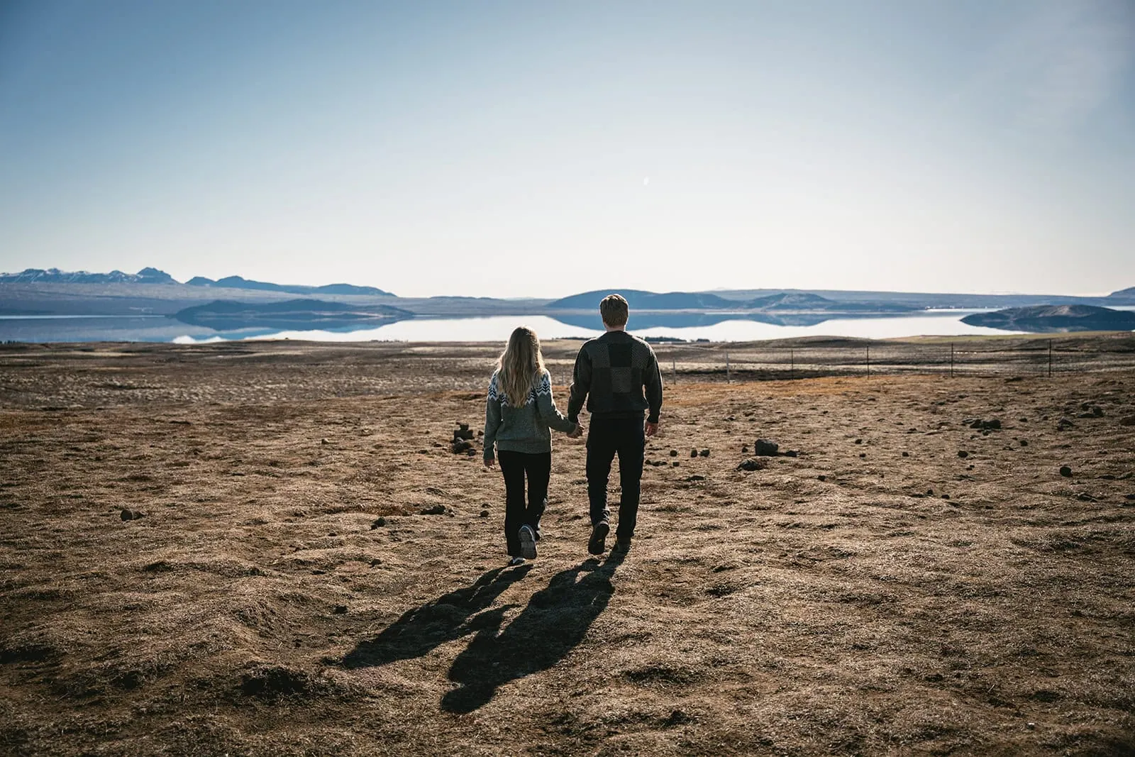 A walk through shadows and sun — their Reynisfjara elopement journey.