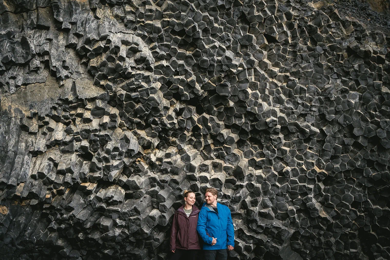 Joyful moment by the basalt columns in a Reynisfjara elopement