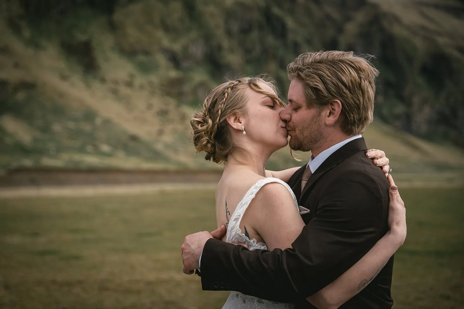 Tender kiss in a Reynisfjara elopement