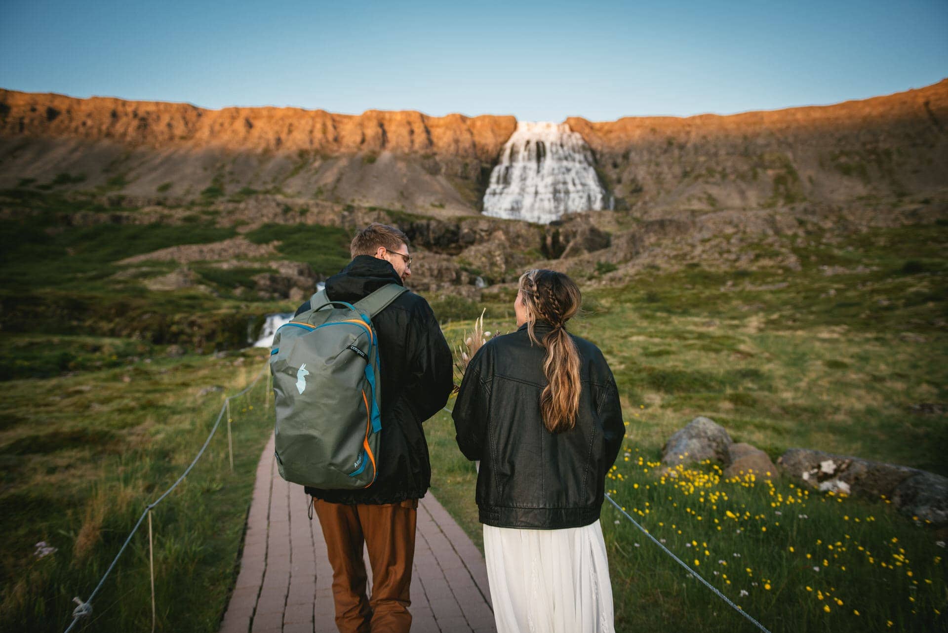 Couple eloping under the Iceland midnight sun in soft late evening light