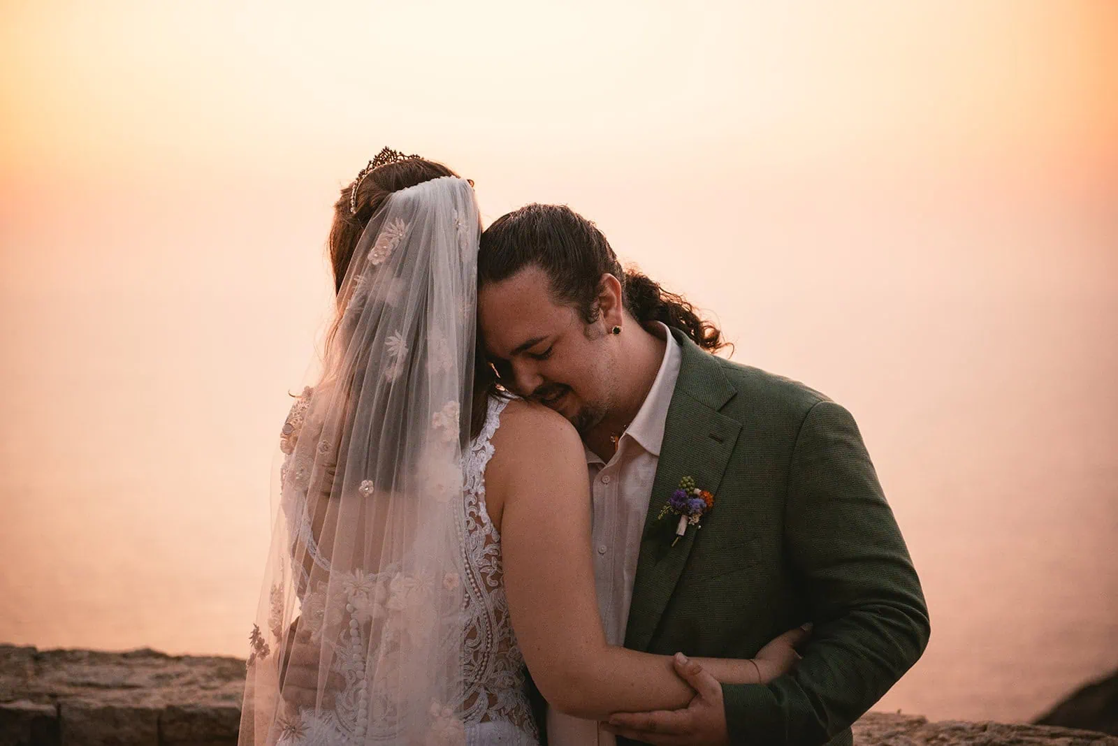 A tender embrace as they're finally newlyweds in a Rhodes Island elopement