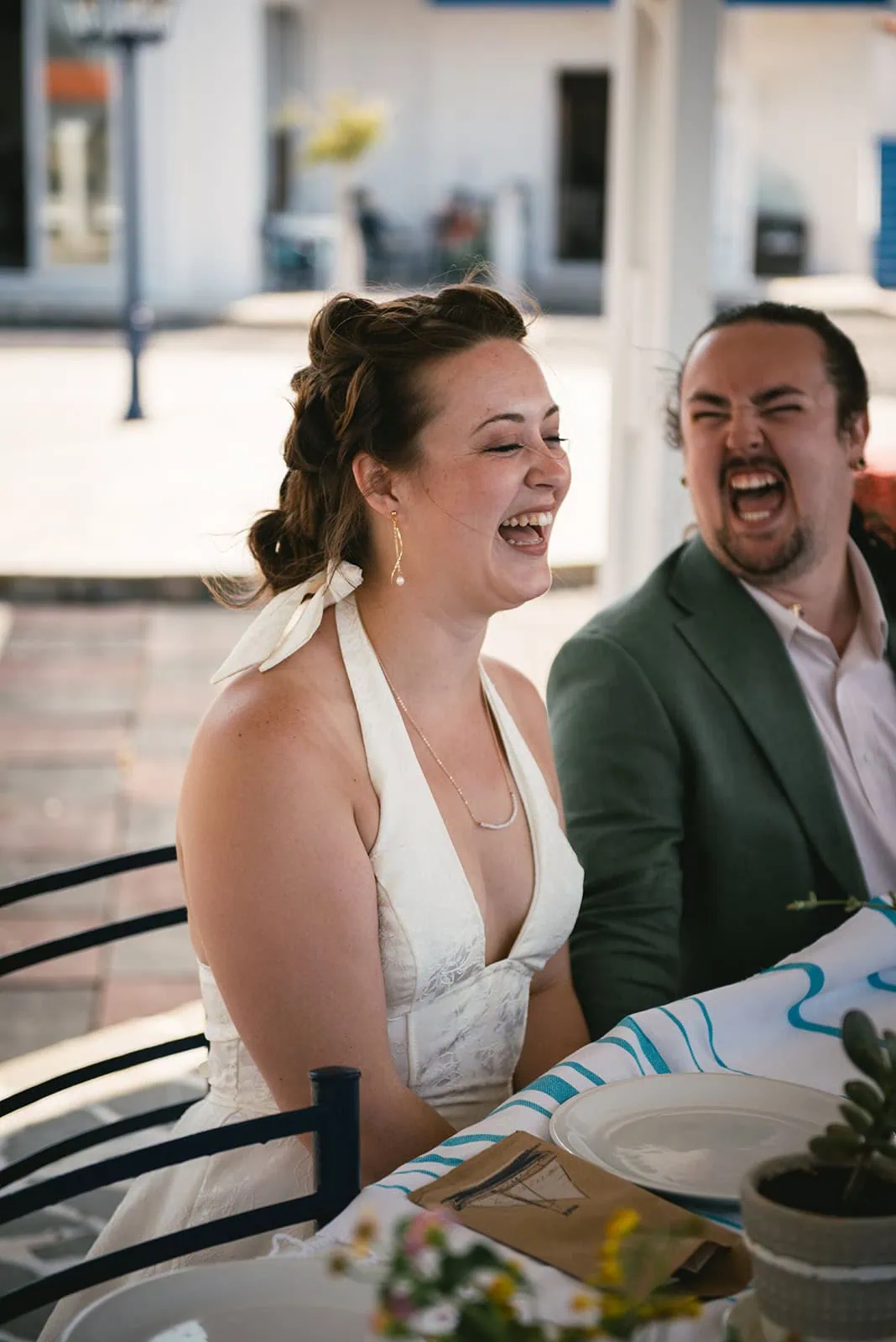 Laughter during this Rhodes Island elopement meal with guests