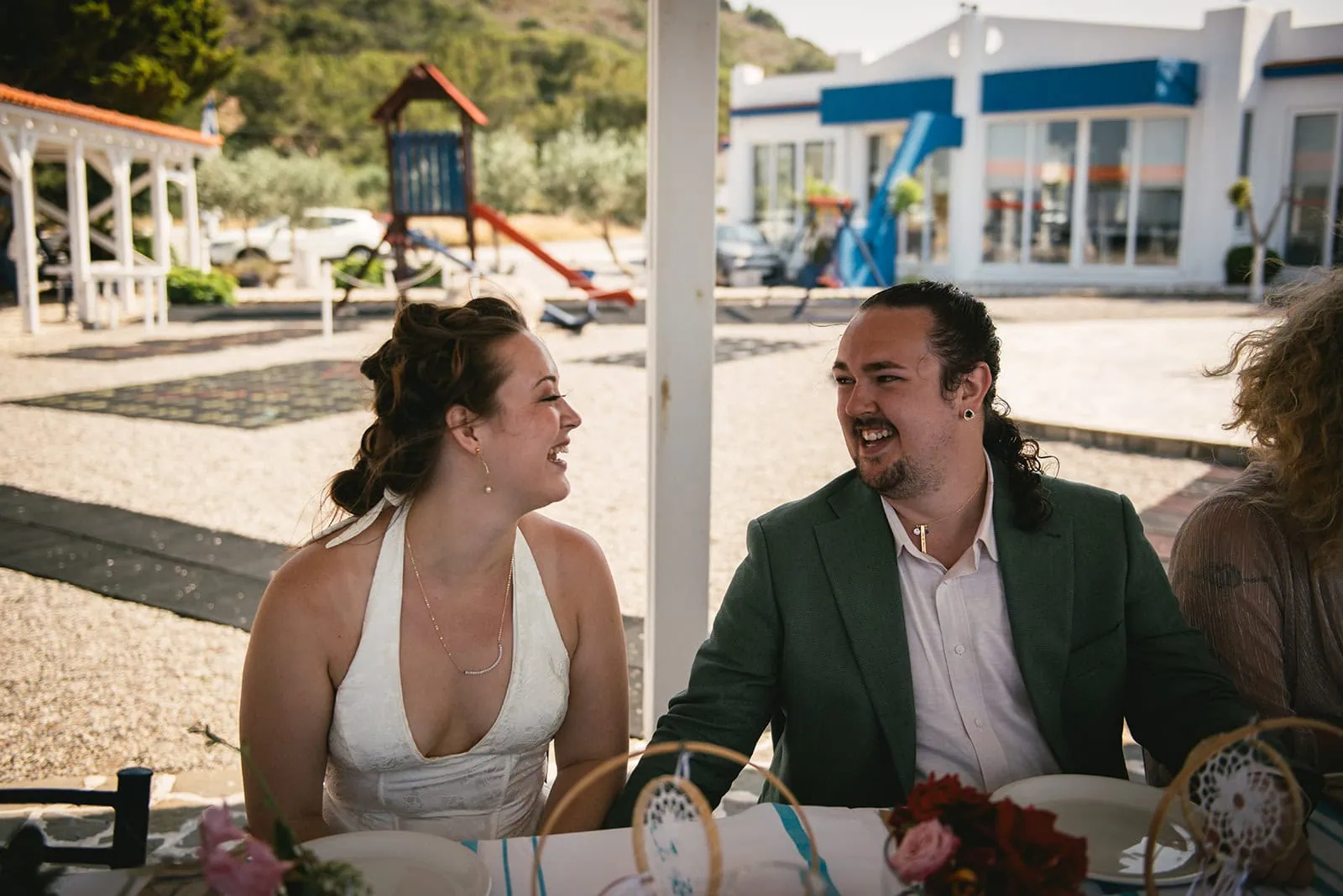 Exchanging a gaze during the meal in their Rhodes Island elopement