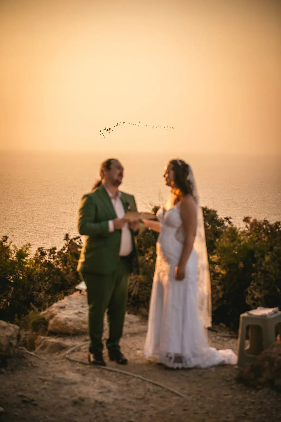Birds in the sunset sky during a Rhodes Island elopement ceremony
