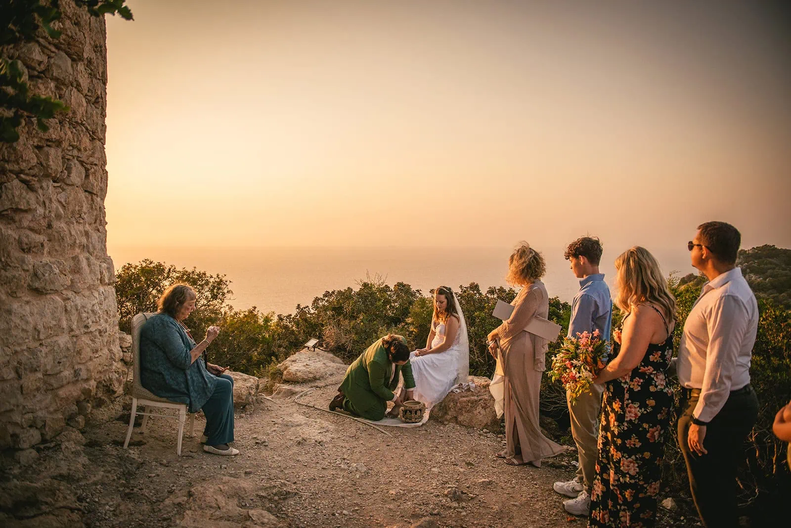 In the golden light of Rhodes, their Rhodes Island elopement ceremony included washing each other’s feet — a timeless act of love and trust