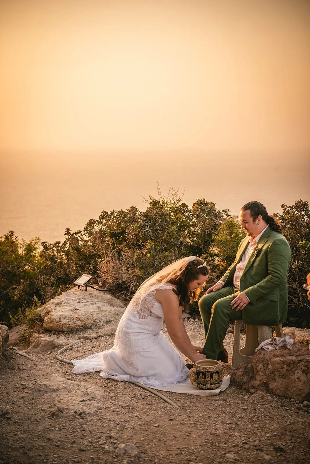 A quiet, intimate moment during this Rhodes Island elopement: two souls washing away the past, stepping into forever with open hearts