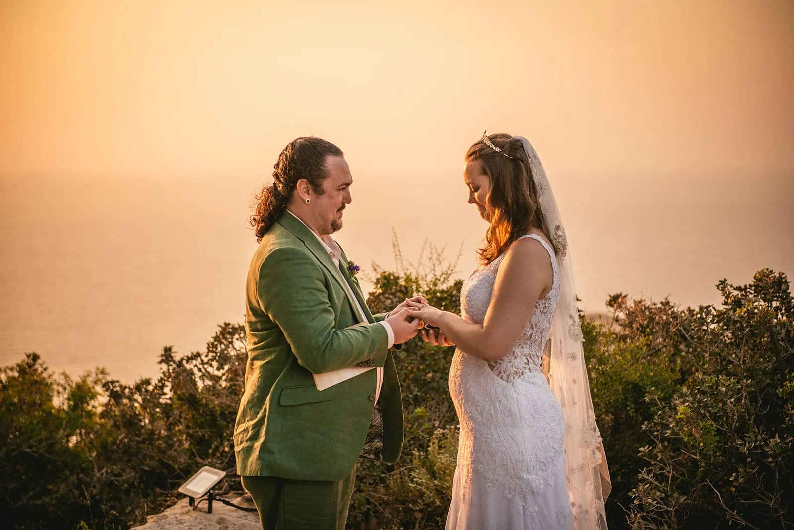 Whispered promises beneath a sky of fire – Rhodes Island elopement glow