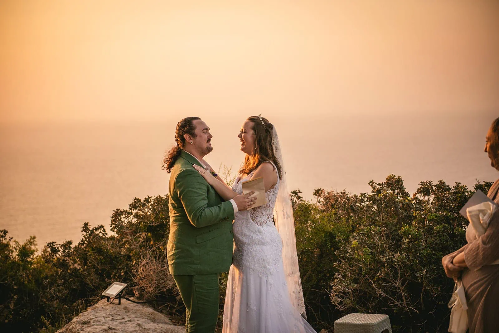 Tender embrace as they become newlyweds in a Rhodes Island elopement