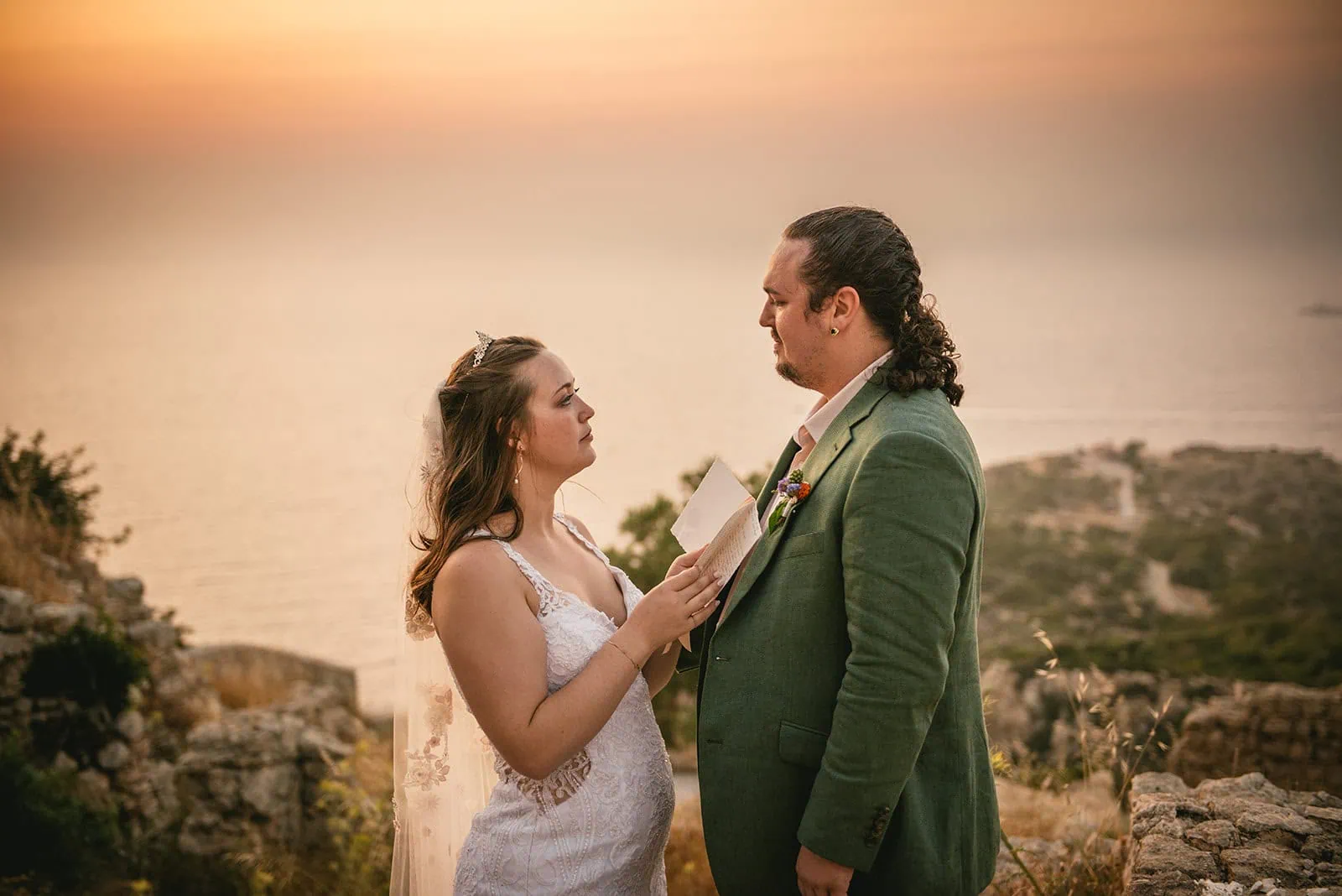 An intimate exchange of vows at sunet in a Rhodes Island elopement