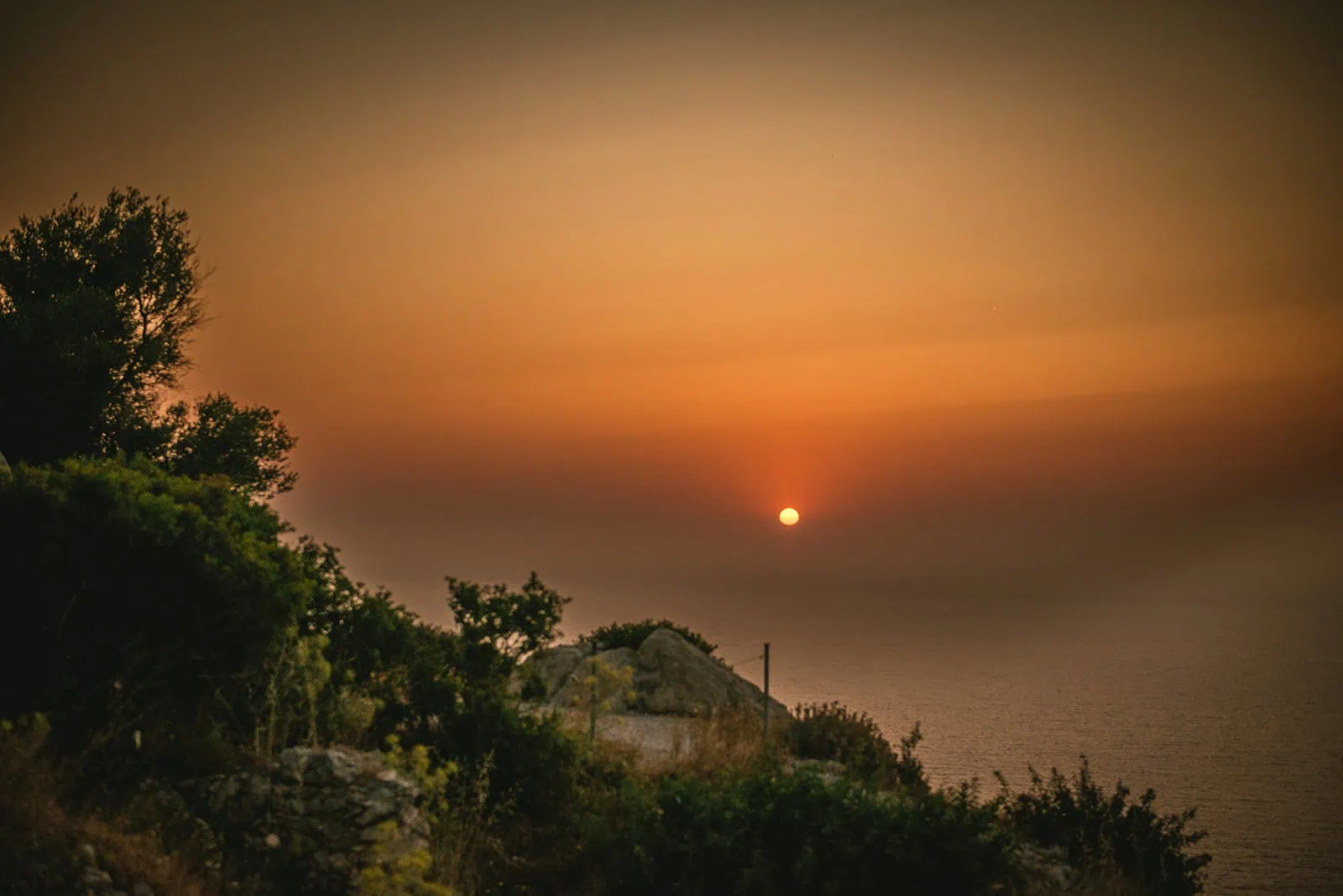 Sunset embracing the ocean in a stunning Rhodes Island elopement
