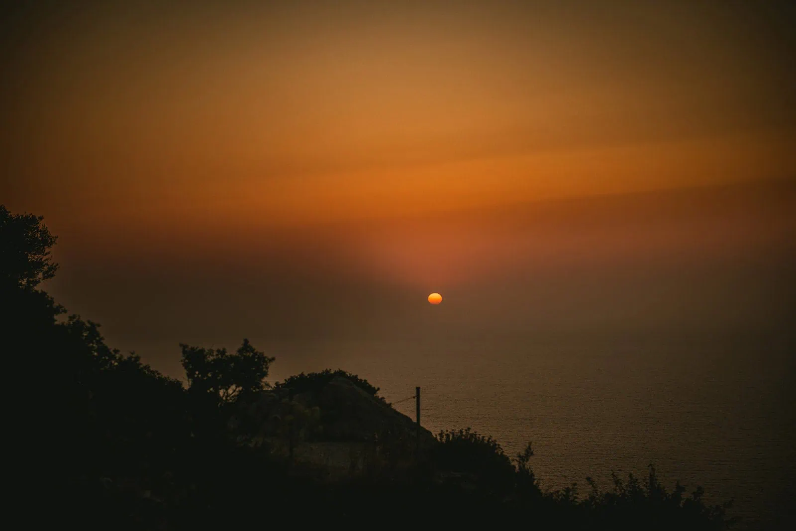 Sunset at the horizon in an epic Rhodes Island elopement