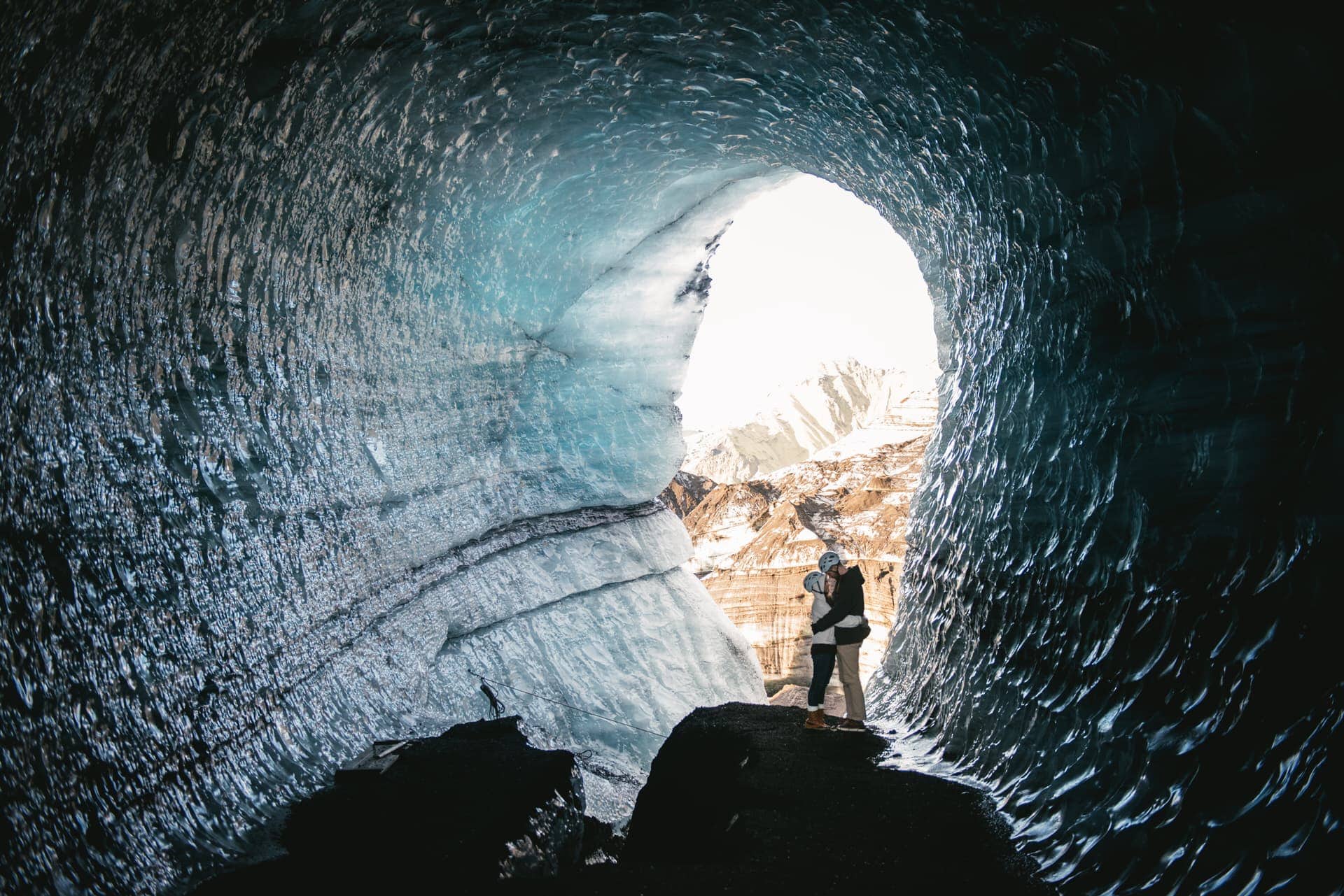 Couple standing on an ancient glacier during their Iceland elopement