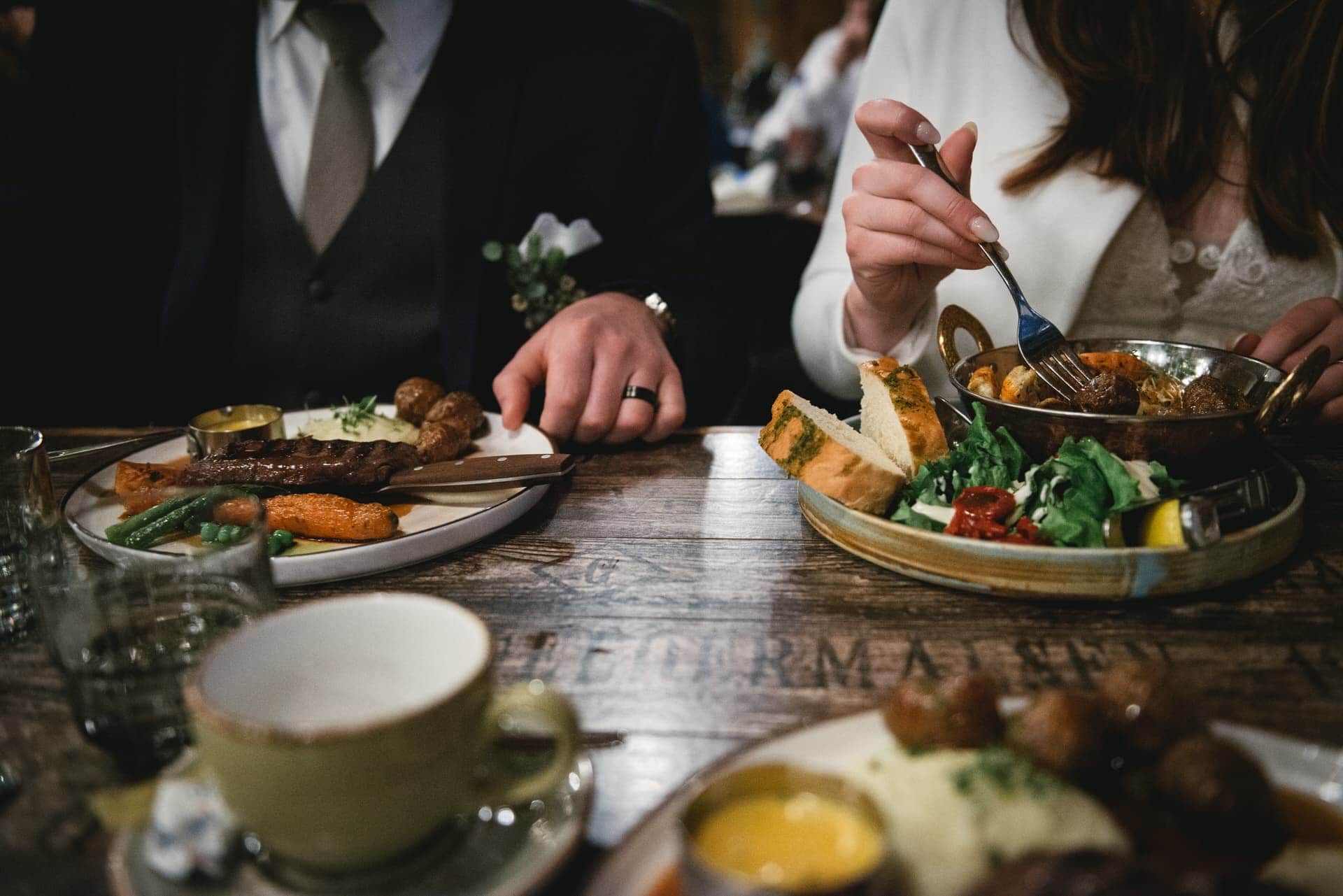 Couple celebrating with a quiet dinner after their Iceland elopement