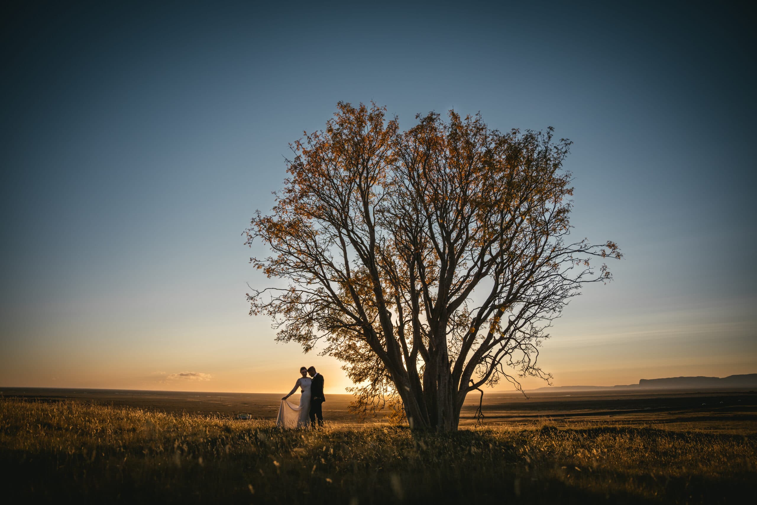 Newlyweds exploring hidden viewpoints after their Iceland elopement ceremony