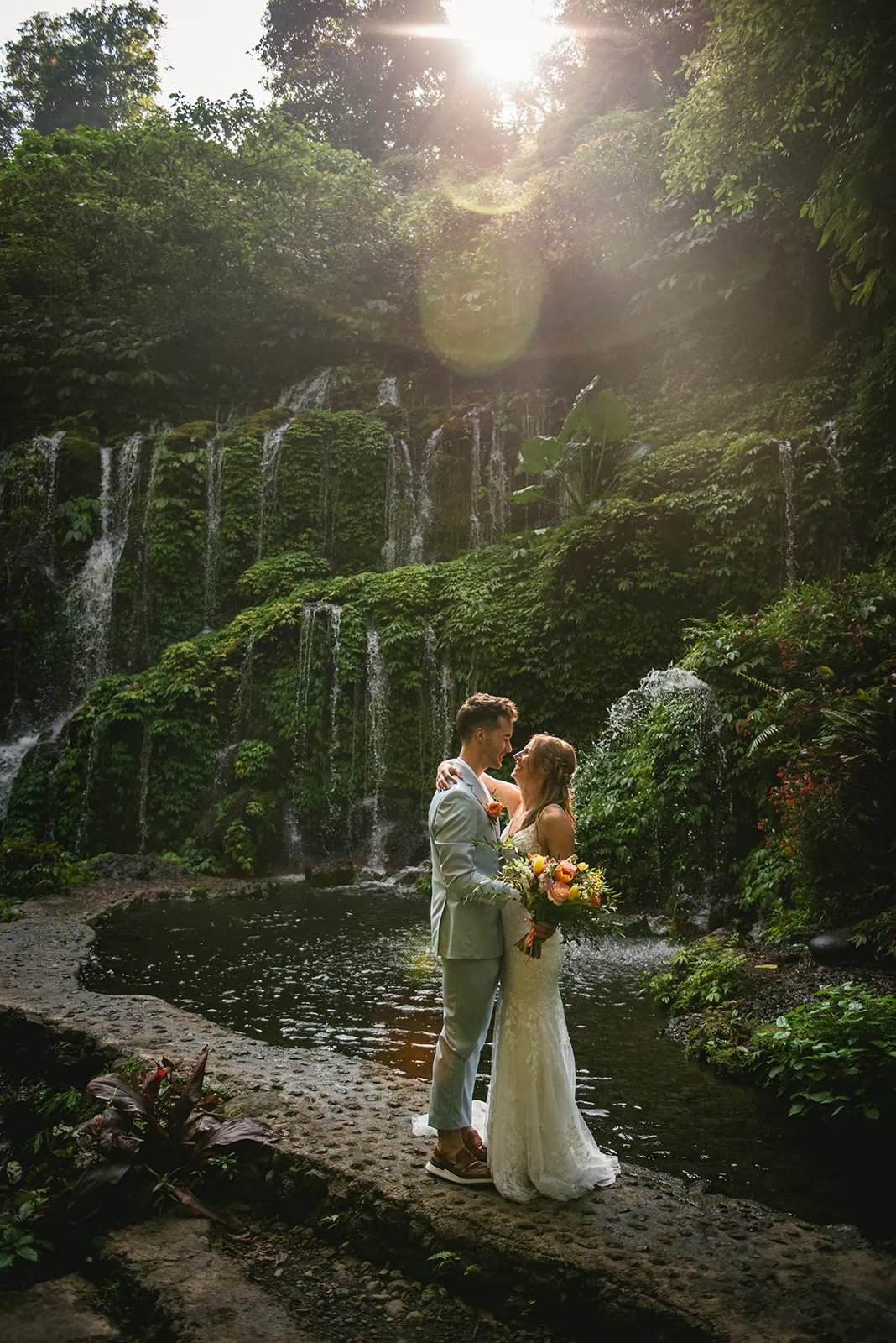 A tender embrace as newlyweds in the jungle after their Bali elopement ceremony