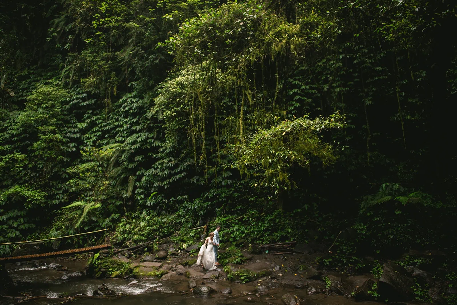 Couple walking side by side in the jungle, soaking in their Bali elopement day