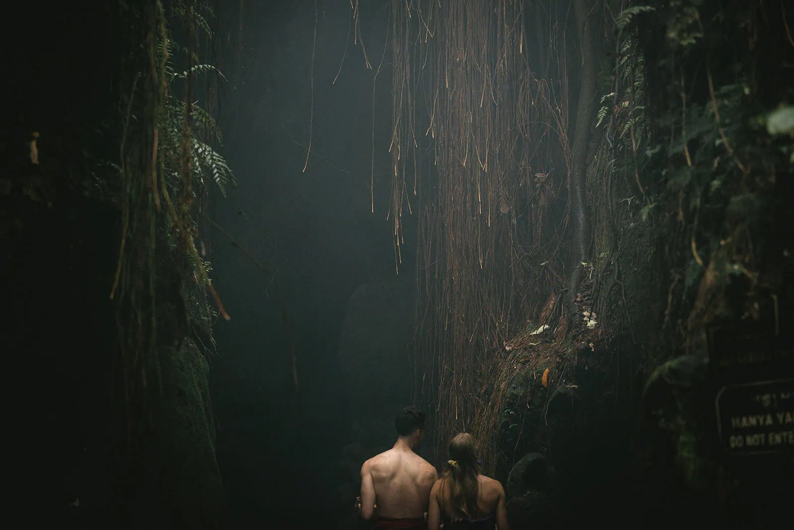 Bride and groom in the dark jungle for their Bali elopement ritual
