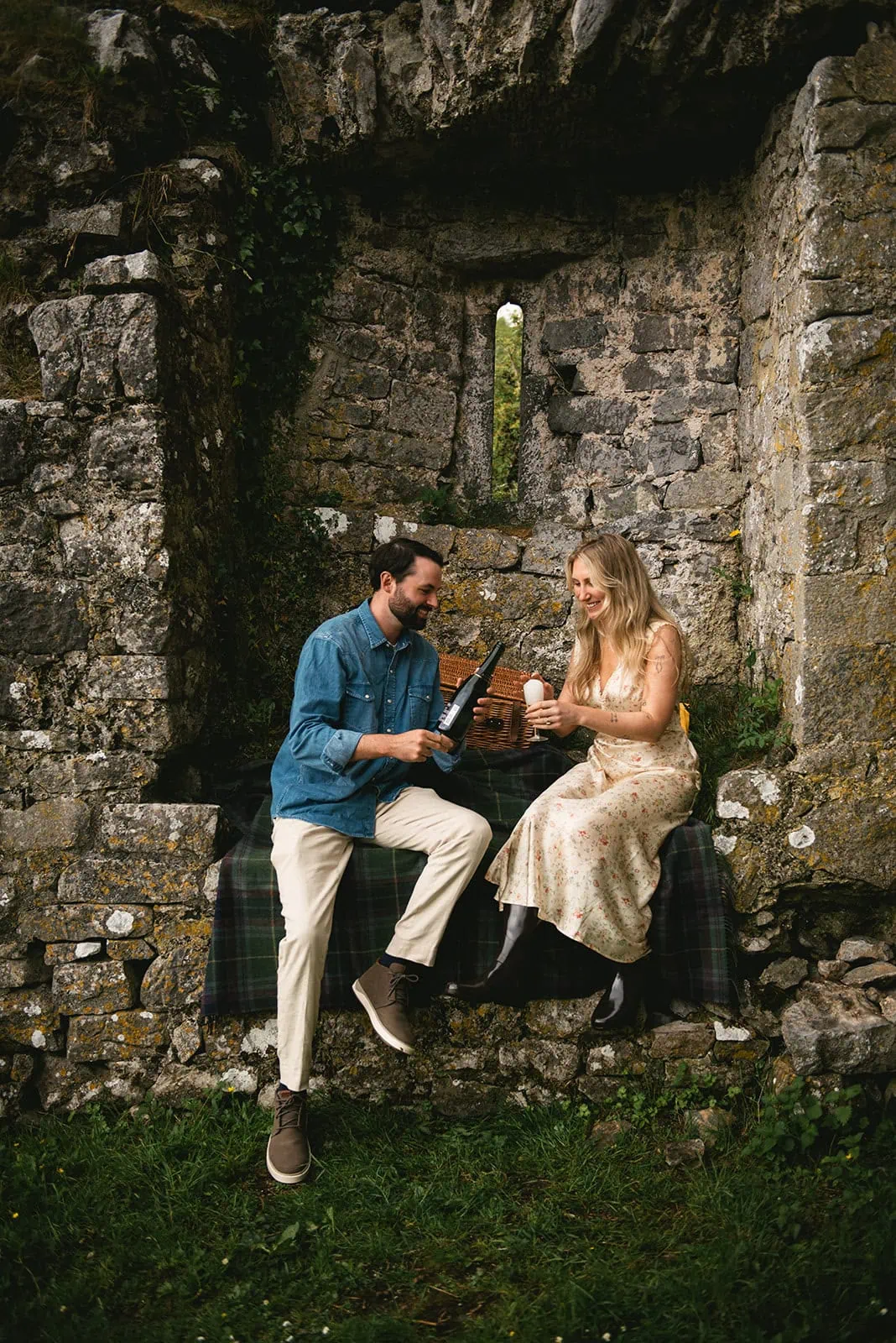 A loving glance exchanged mid-picnic in the woods during this heartfelt Ireland elopement
