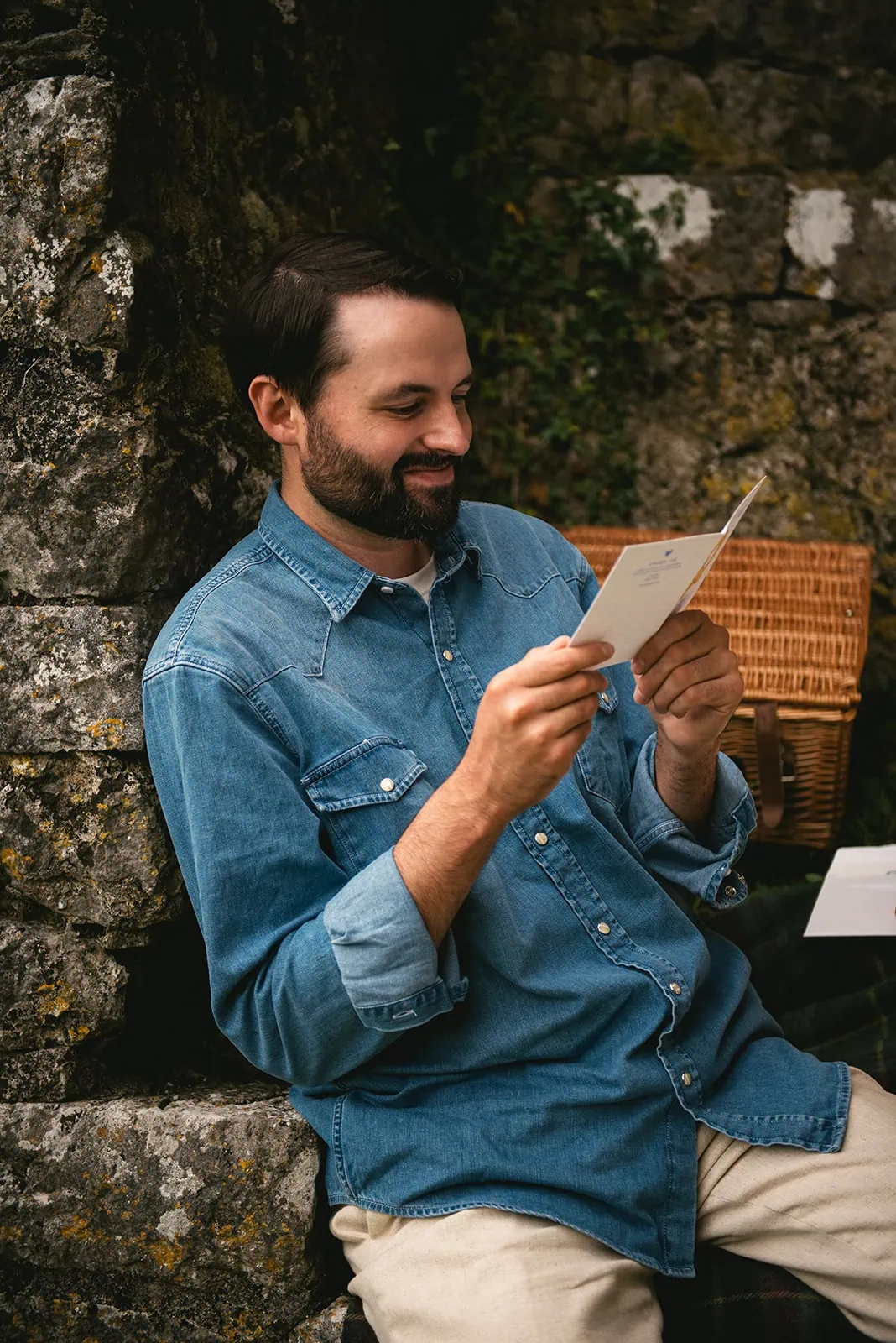 Groom reading a letter from his loved ones during his Ireland elopement