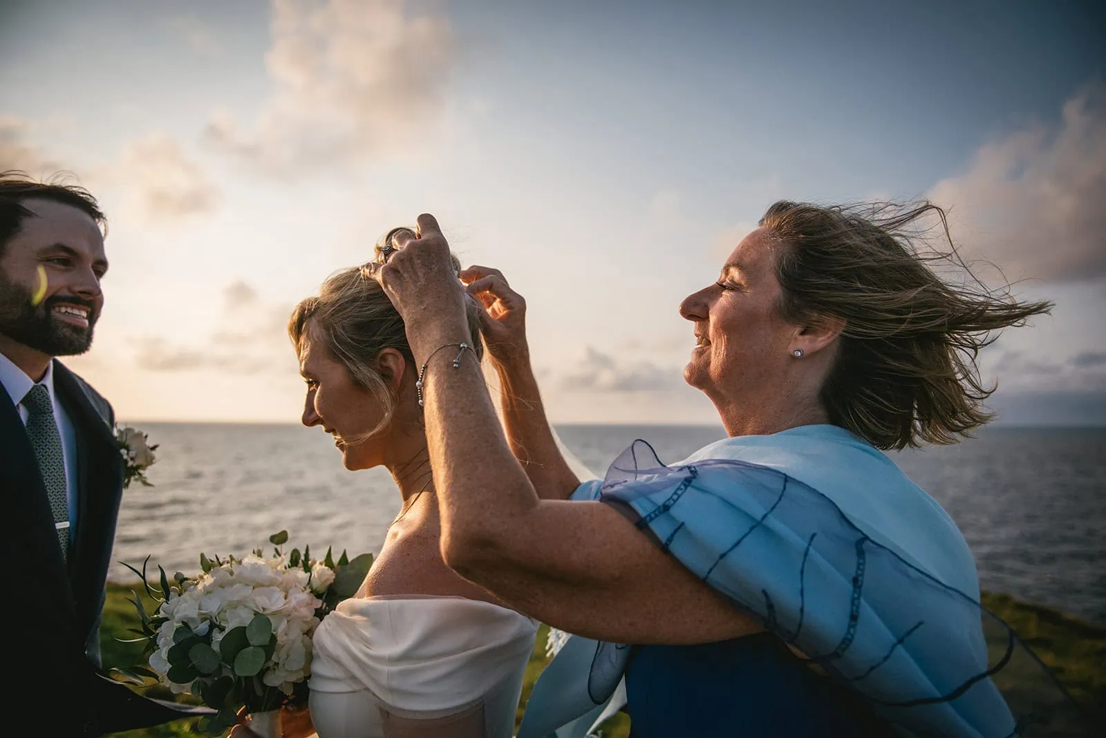 The mother of the bride adding her veil for the ceremony of her Ireland elopement