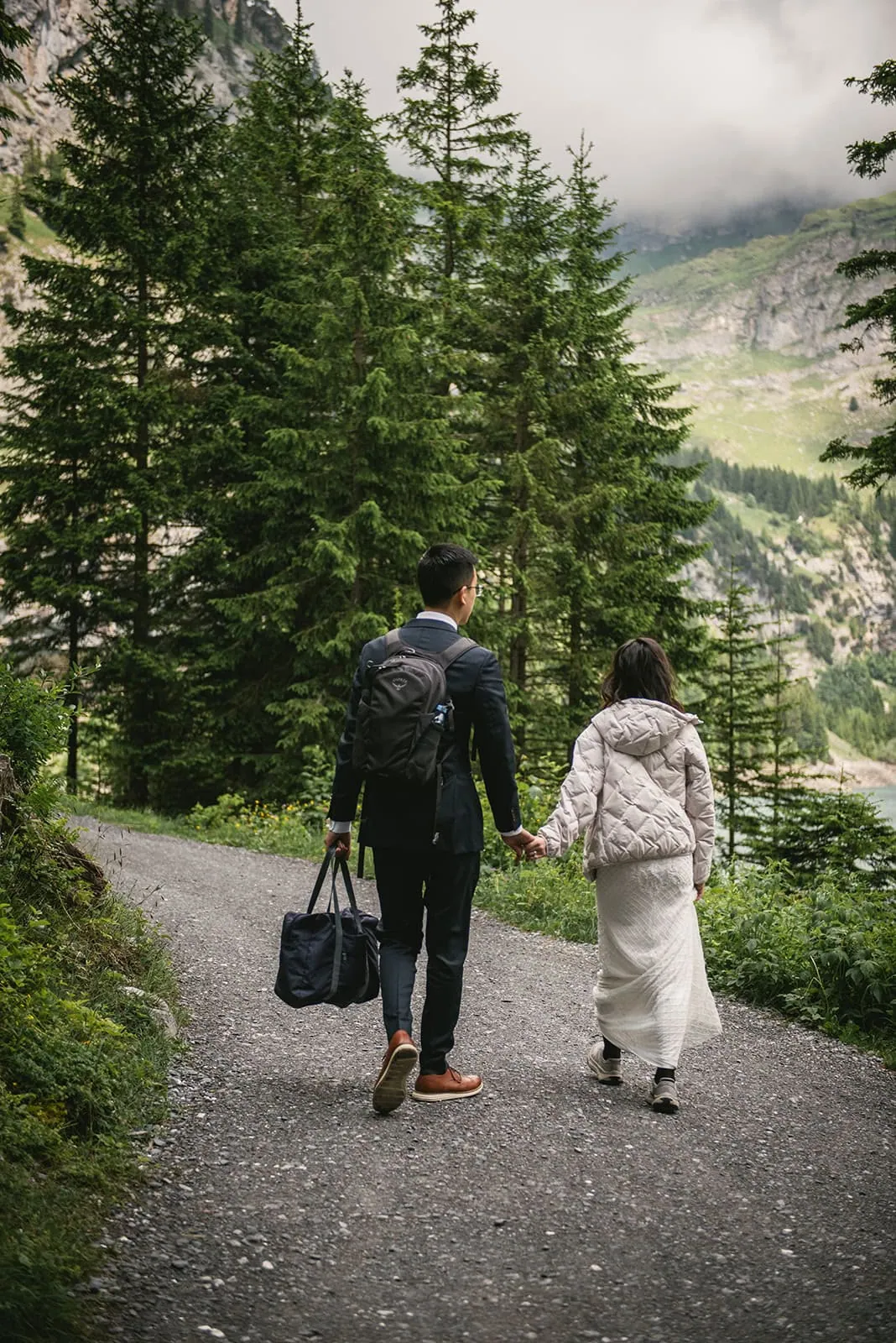 Their hands found each other beneath a sky of stone—Oeschinensee elopement tenderness