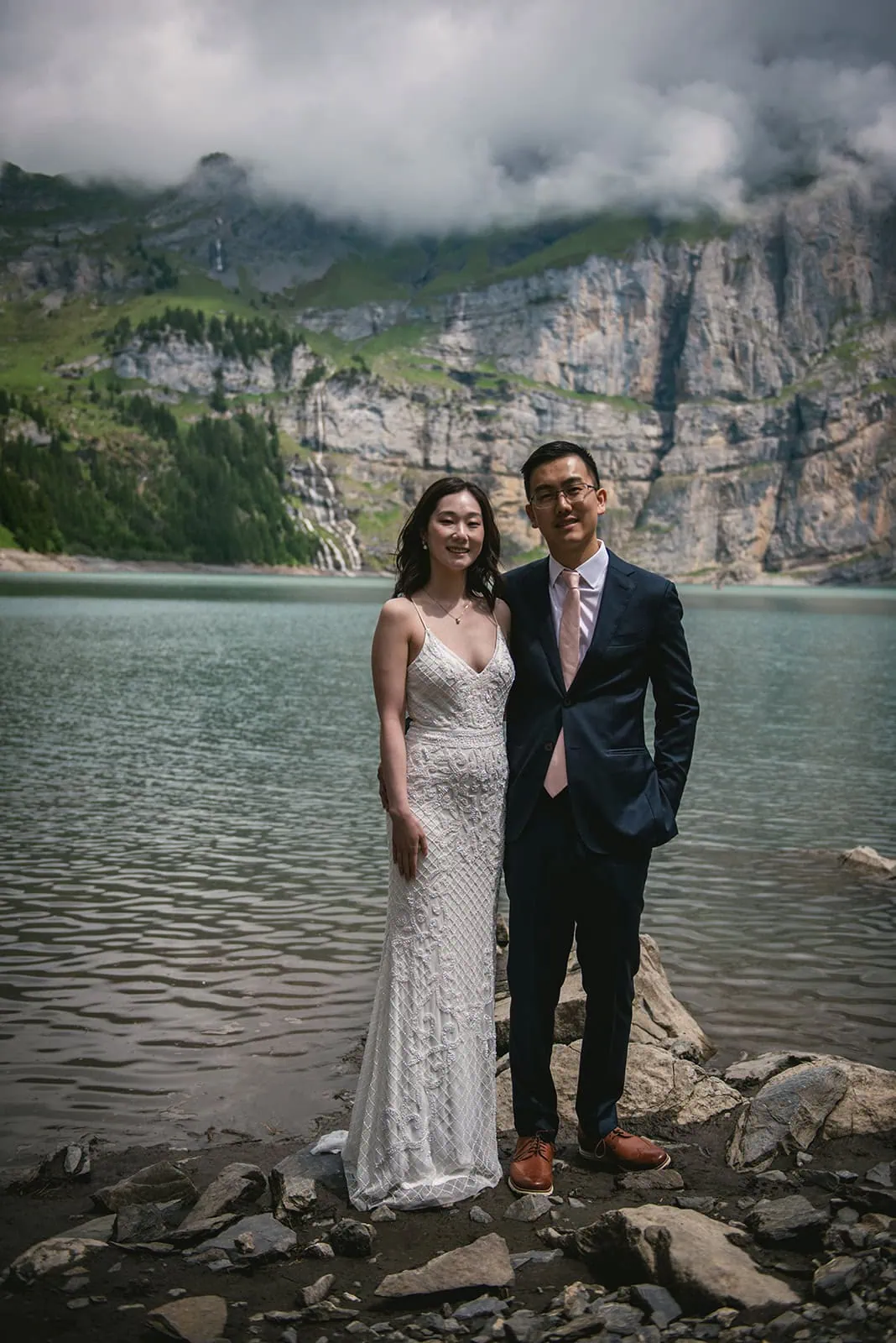 Portrait of the bride and groom by the lake after ther Oeschinensee elopement ceremony