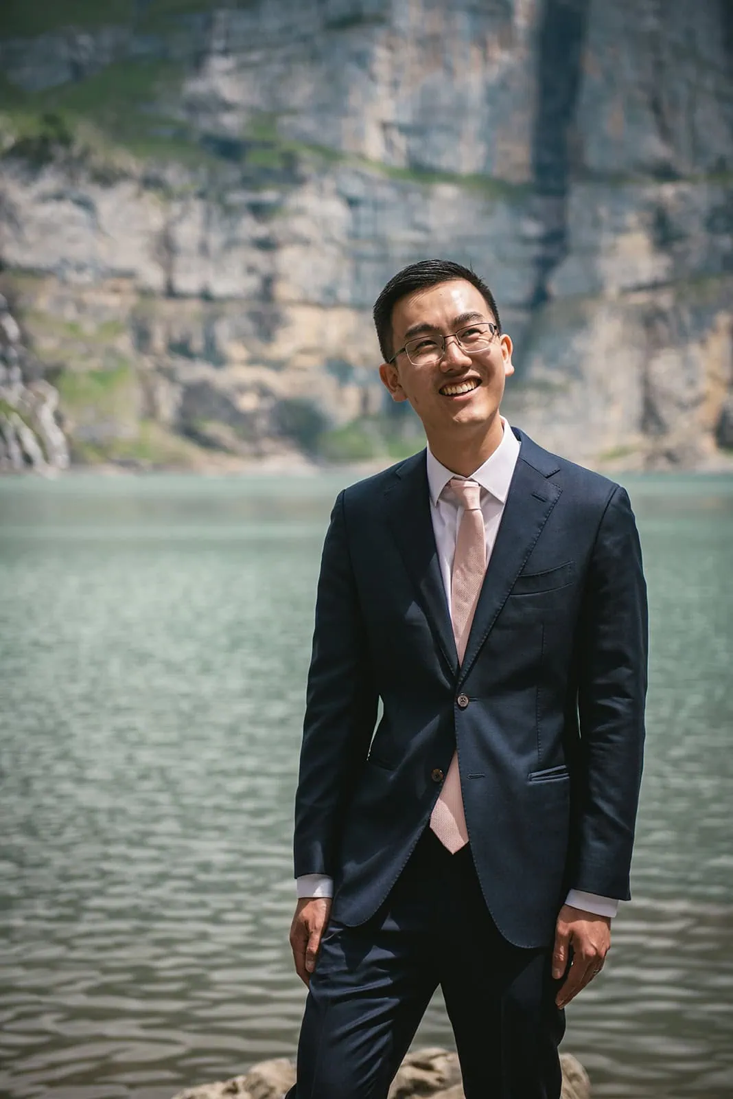 Portrait of the groom by the lake in his Oeschinensee elopement