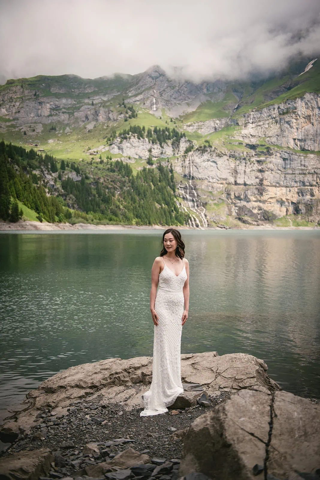 Stunning portrait of th ebride by the lake during her Oeschinensee elopement