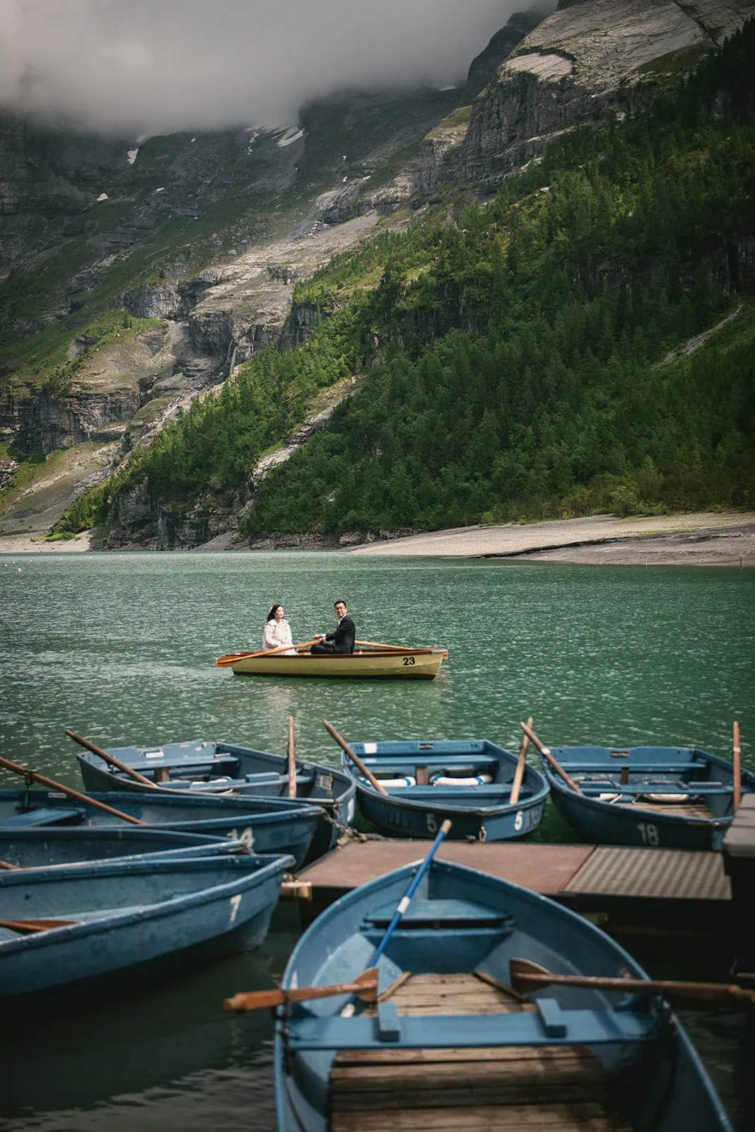 On the emerald edge of the lake, their Oeschinensee elopement unfolded