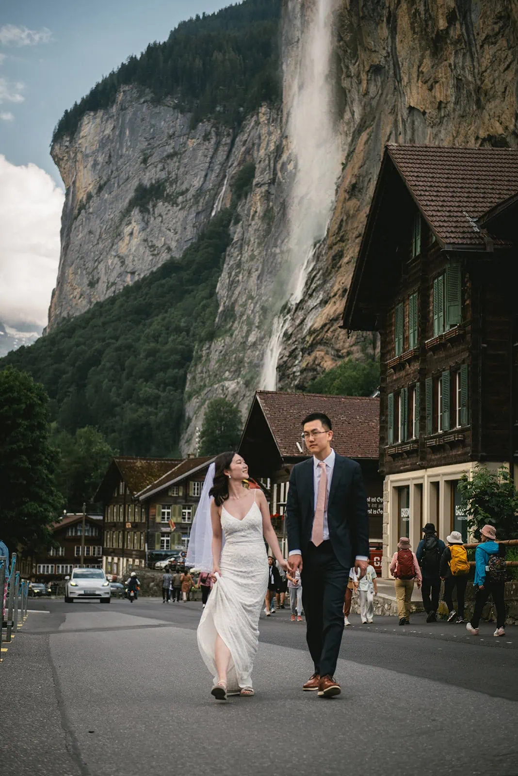 Enjoying a moment in a Swiss town, a tender moment in their Oeschinensee elopement