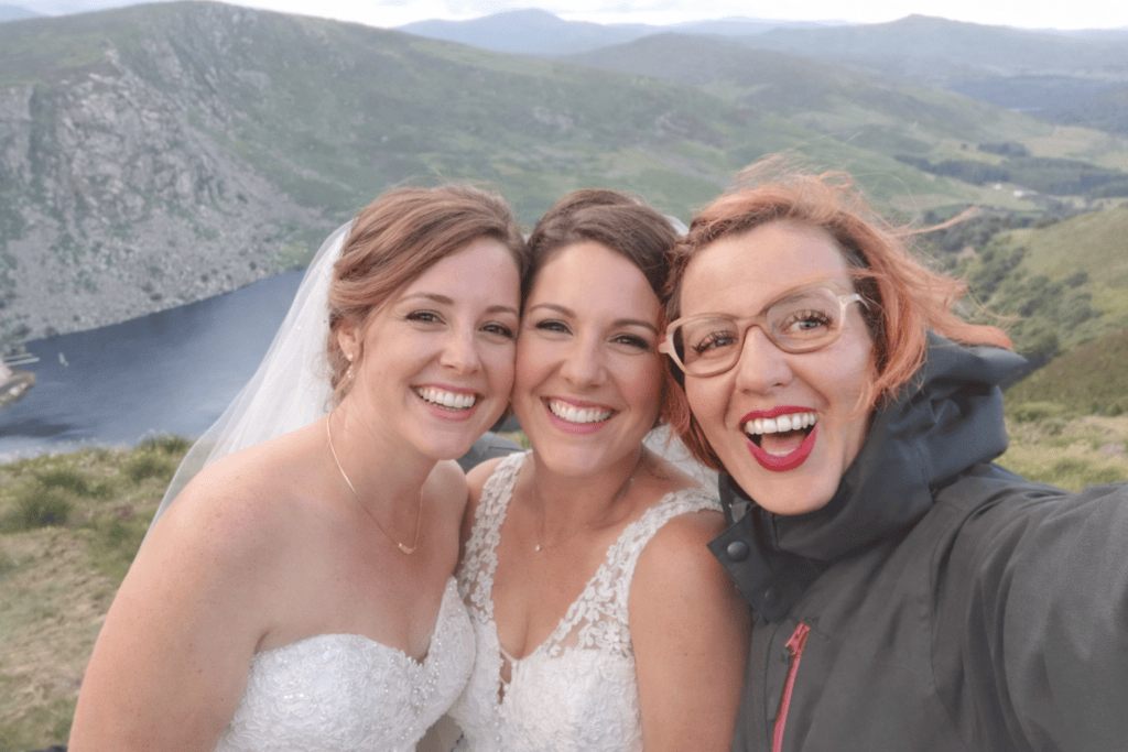 Amber, Ireland elopement photographer and planner, with a couple during their elopement