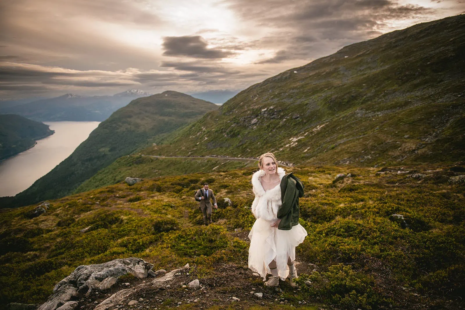 Bride at sunset, enjoying the scenery after her fjords elopement ceremony