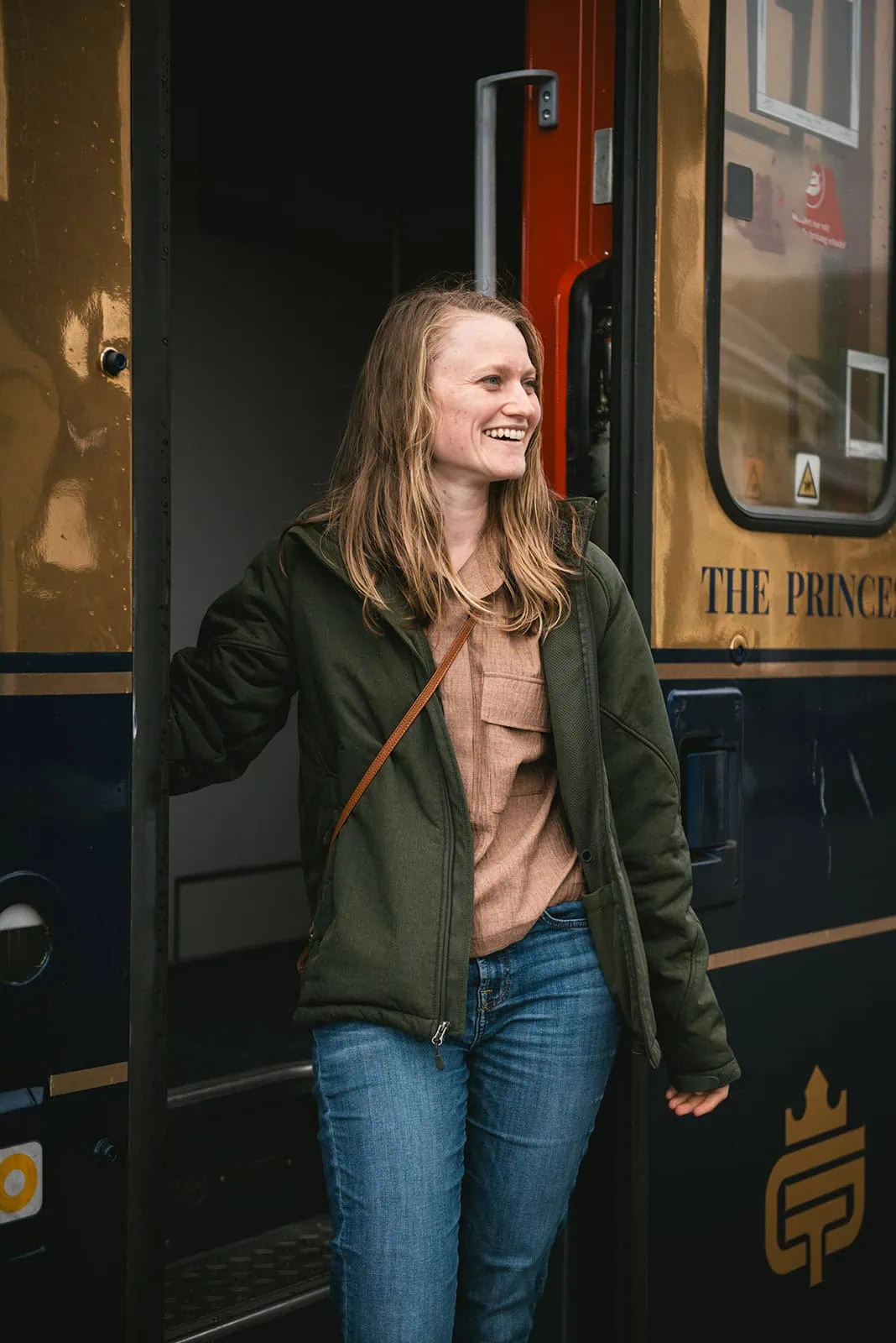 Portrait of the bride by the Golden train during her fjords elopement in Norway