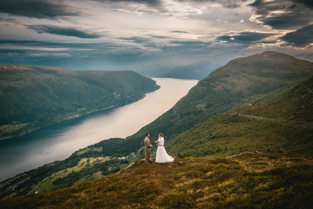 The dramatic mountain backdrop of this fjords elopement ceremony