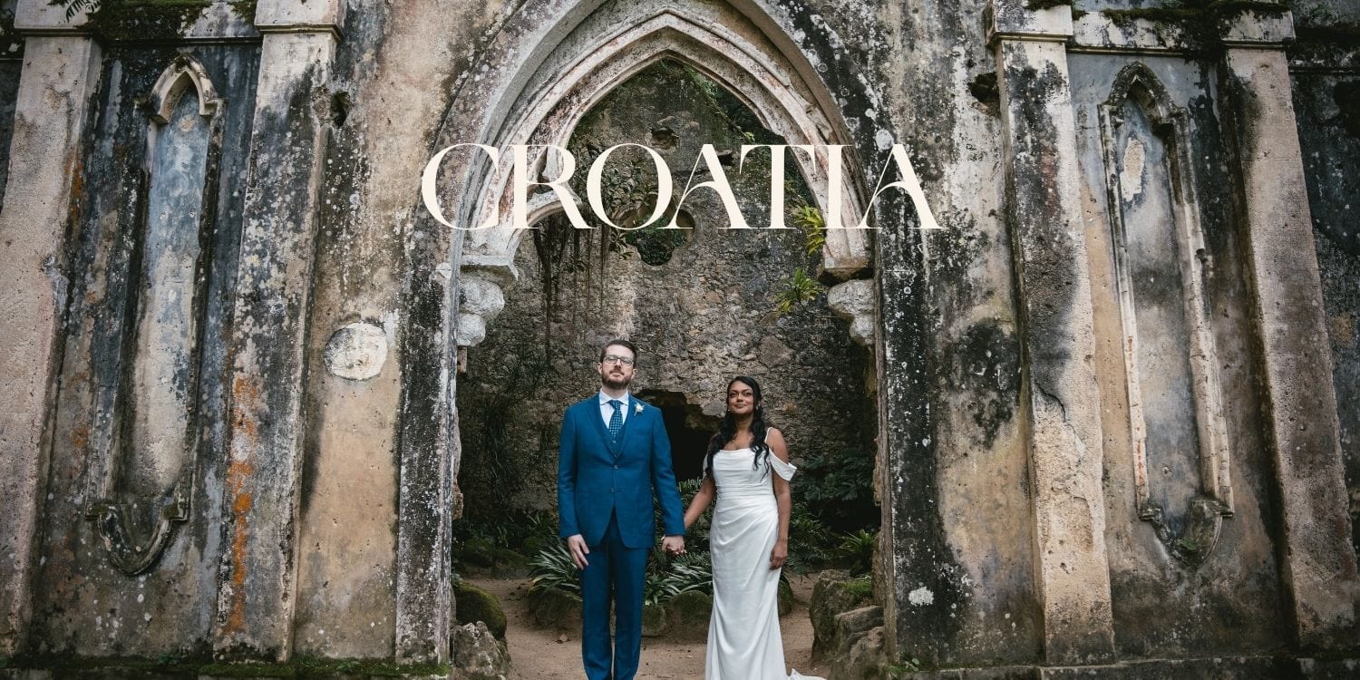 Romantic couple in wedding attire at ancient Icelandic ruins for elopement.