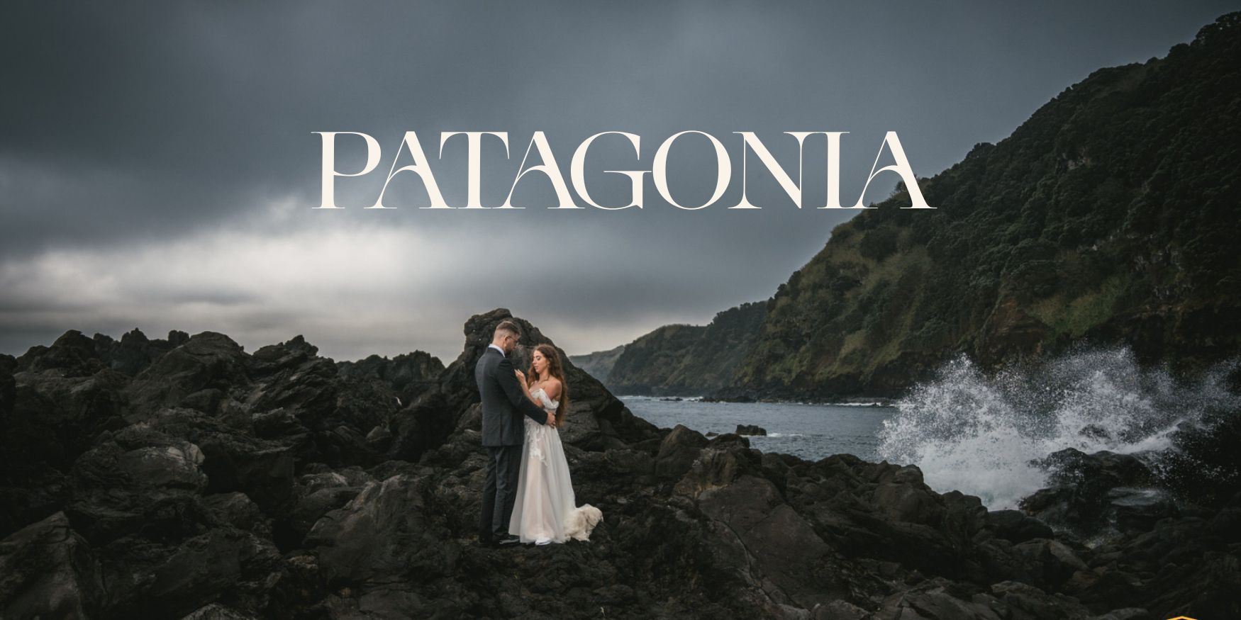 Romantic couple eloping on rugged Iceland coast with ocean waves crashing.