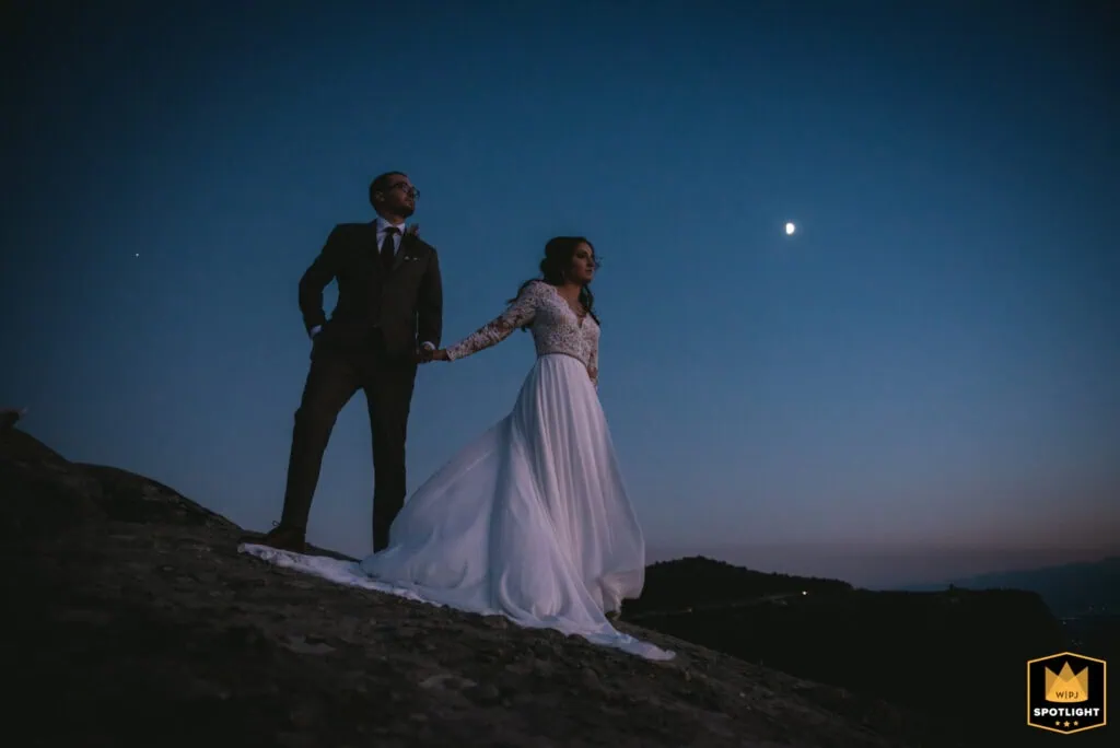 Romantic couple in wedding attire during sunset in Greece, perfect for elopement packages.