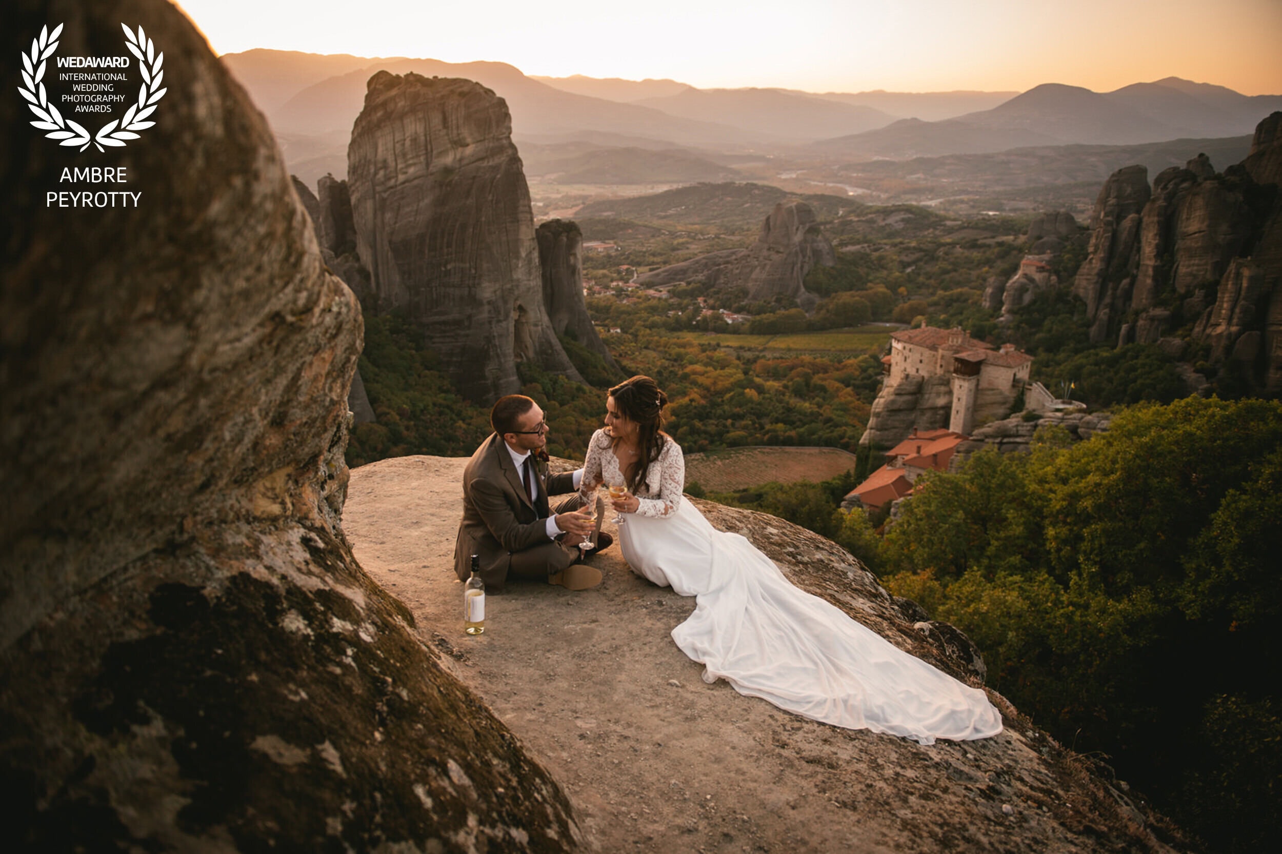Romantic couple eloping in Greece's scenic mountains with stunning rock formations.