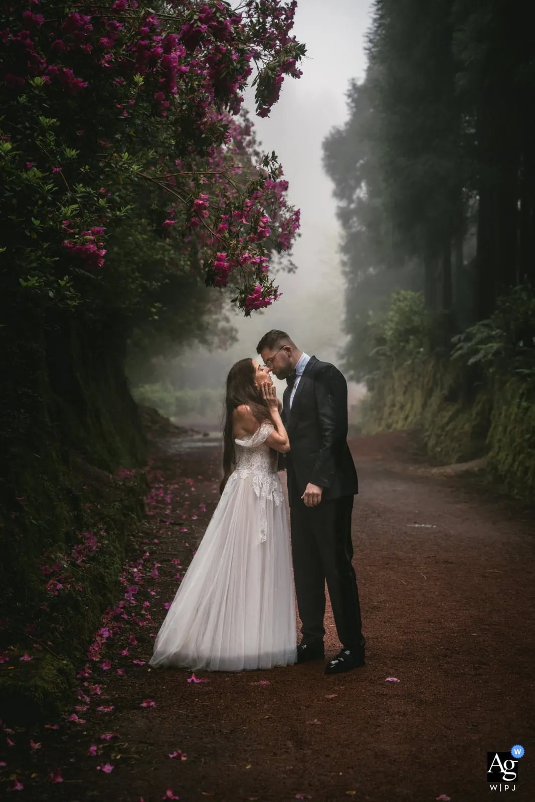 Couple embracing in a dramatic landscape during their intentional multi-day destination elopement