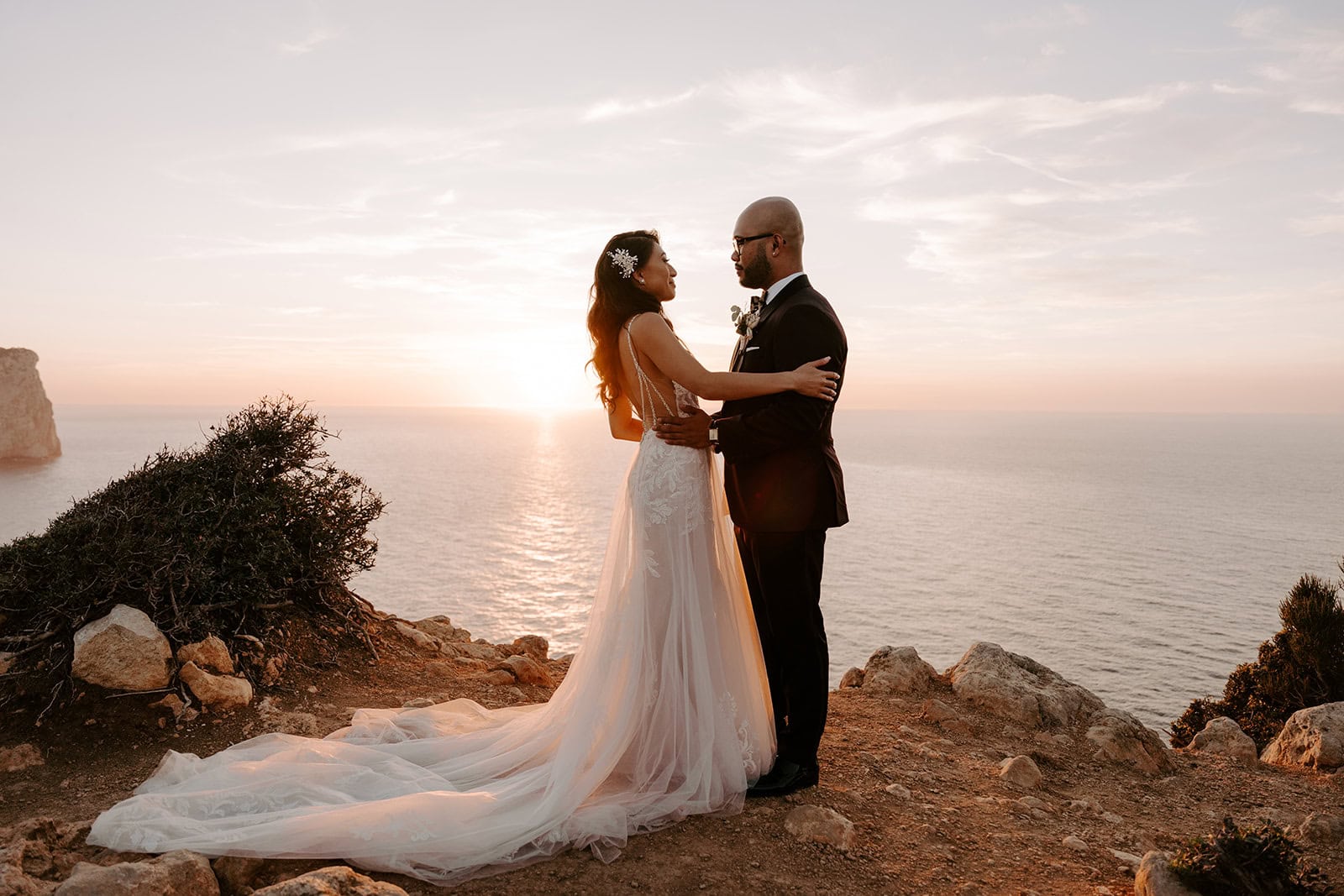 Elopement of Zephyr & Luna on Mallorca with ocean sunset backdrop.