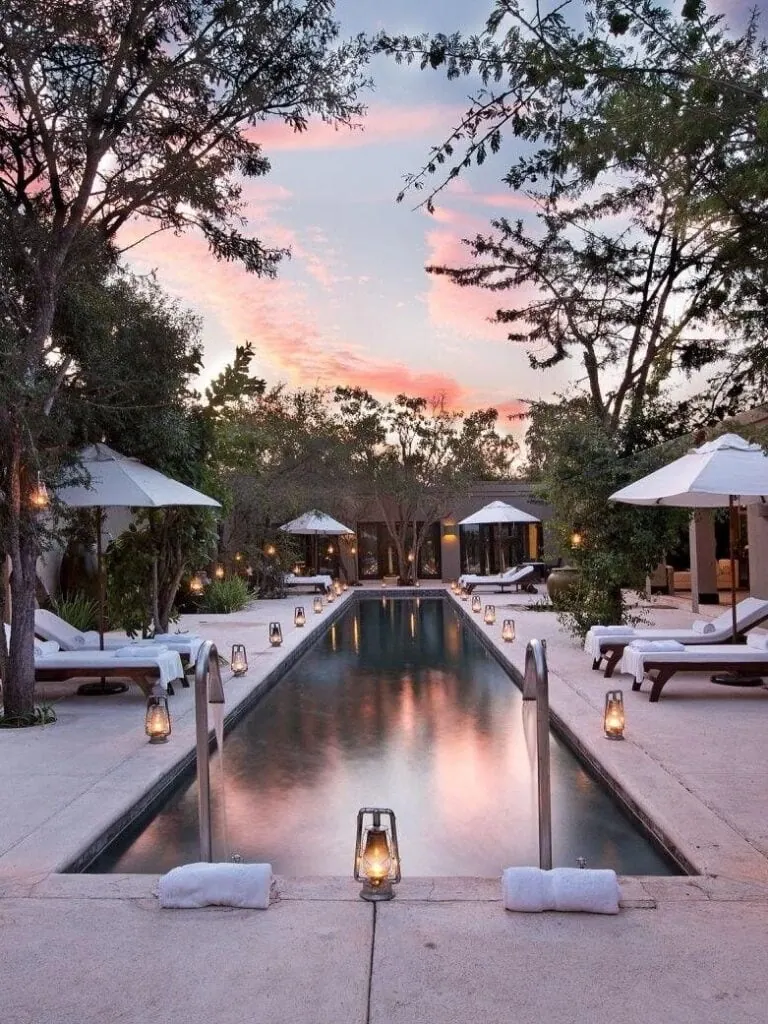 Elopement in South Africa with a stunning poolside setting at sunset, perfect for romantic ceremonie.