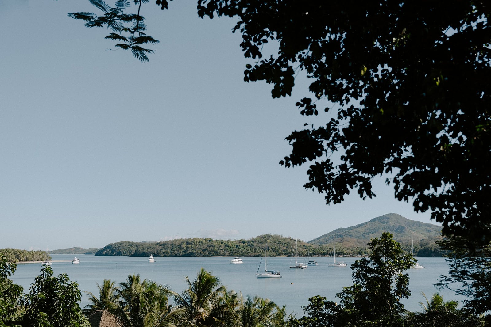 Elopement at Yasawa Islands with ocean view and sailboats.