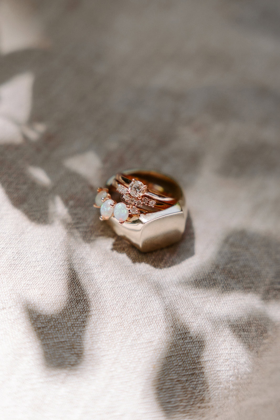 Elegant rings for beach elopement at sunset.
