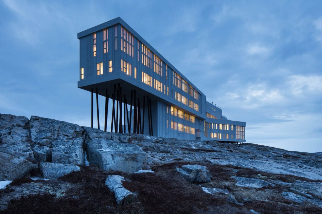 Elegant modern building on rocky landscape at dusk, perfect for Canadian elopements.