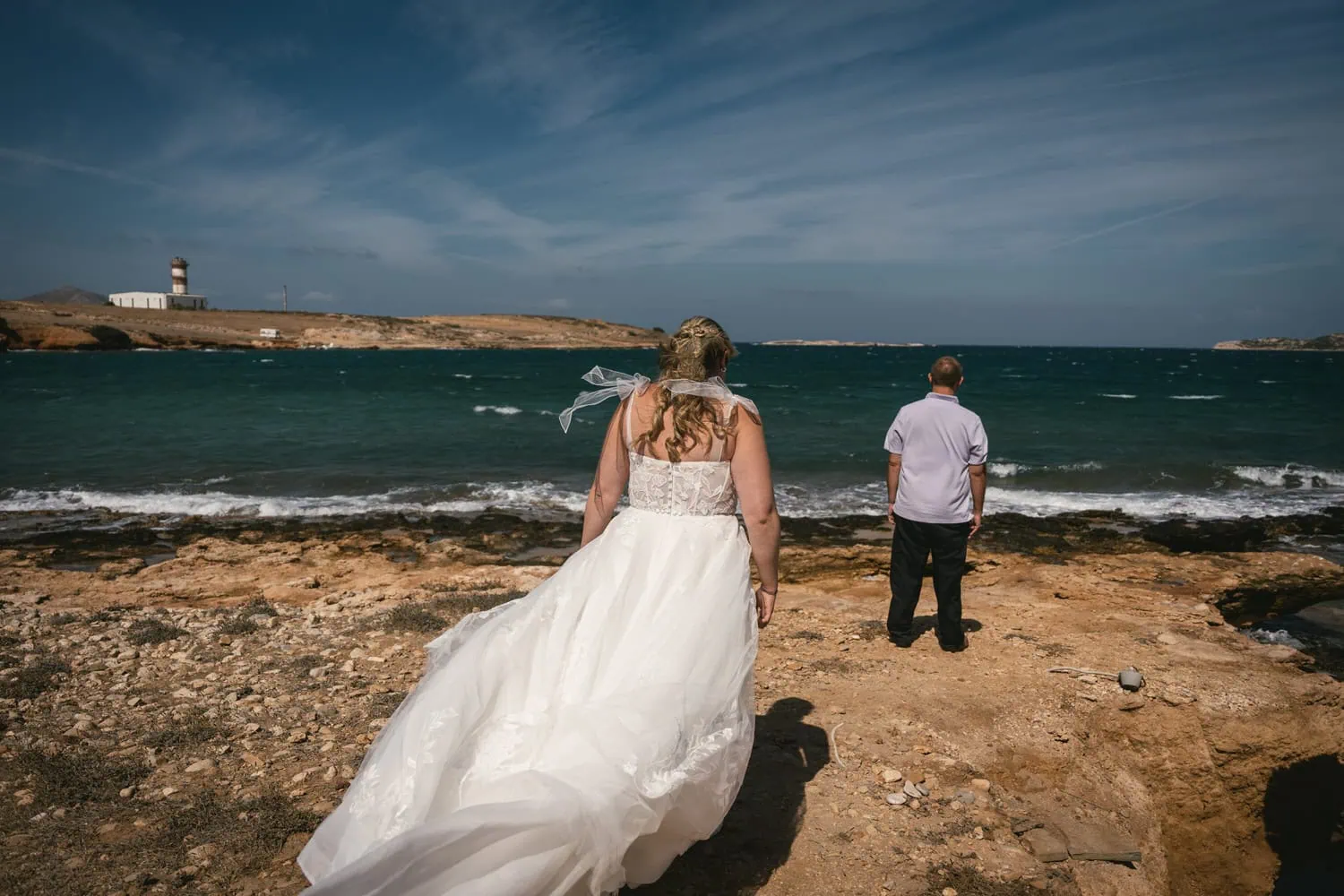Bride and groom at sunset on Paros island, Greece, during a romantic elopement.