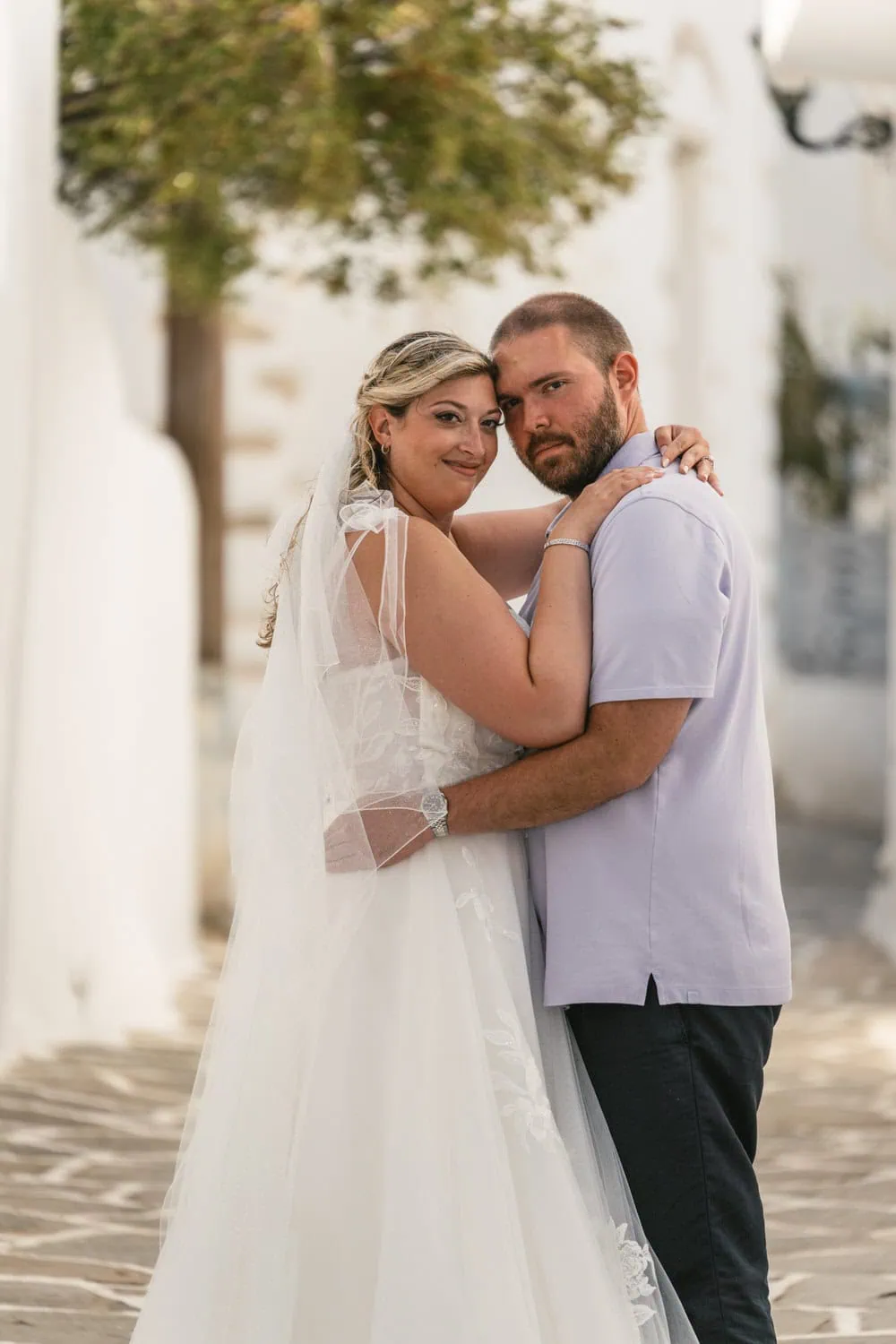 Elopement couple embracing during sunset on Greek island of Paros.