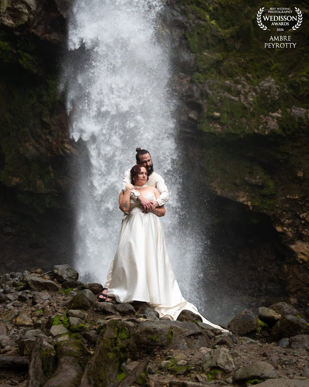 Elopement couple beneath a rainforest waterfall on Taveuni island, Fiji
