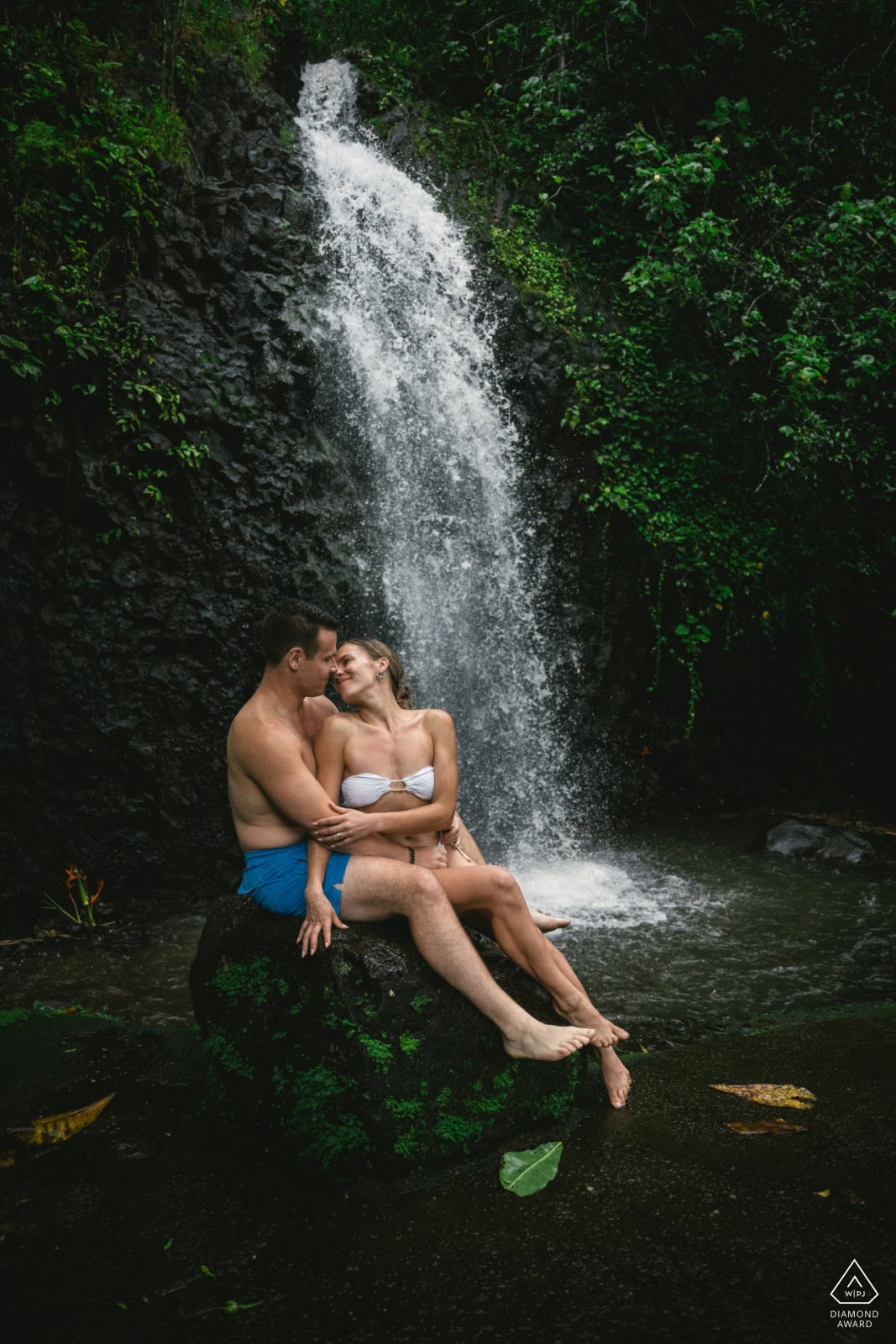 Couple in the green highlands of Viti Levu with mountain ranges behind them, Fiji elopement